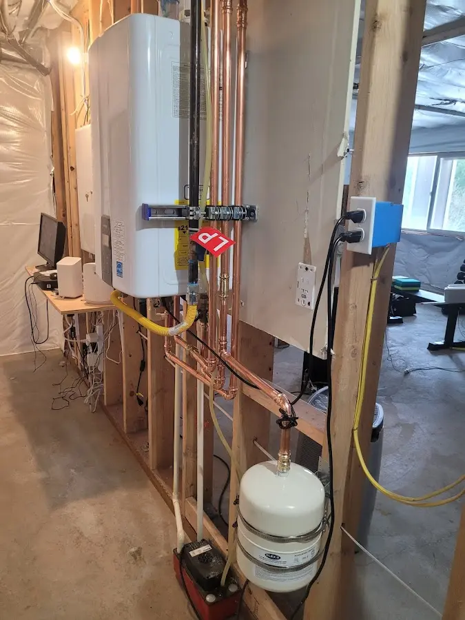 Licensed plumber repairing a kitchen sink in Plumsted